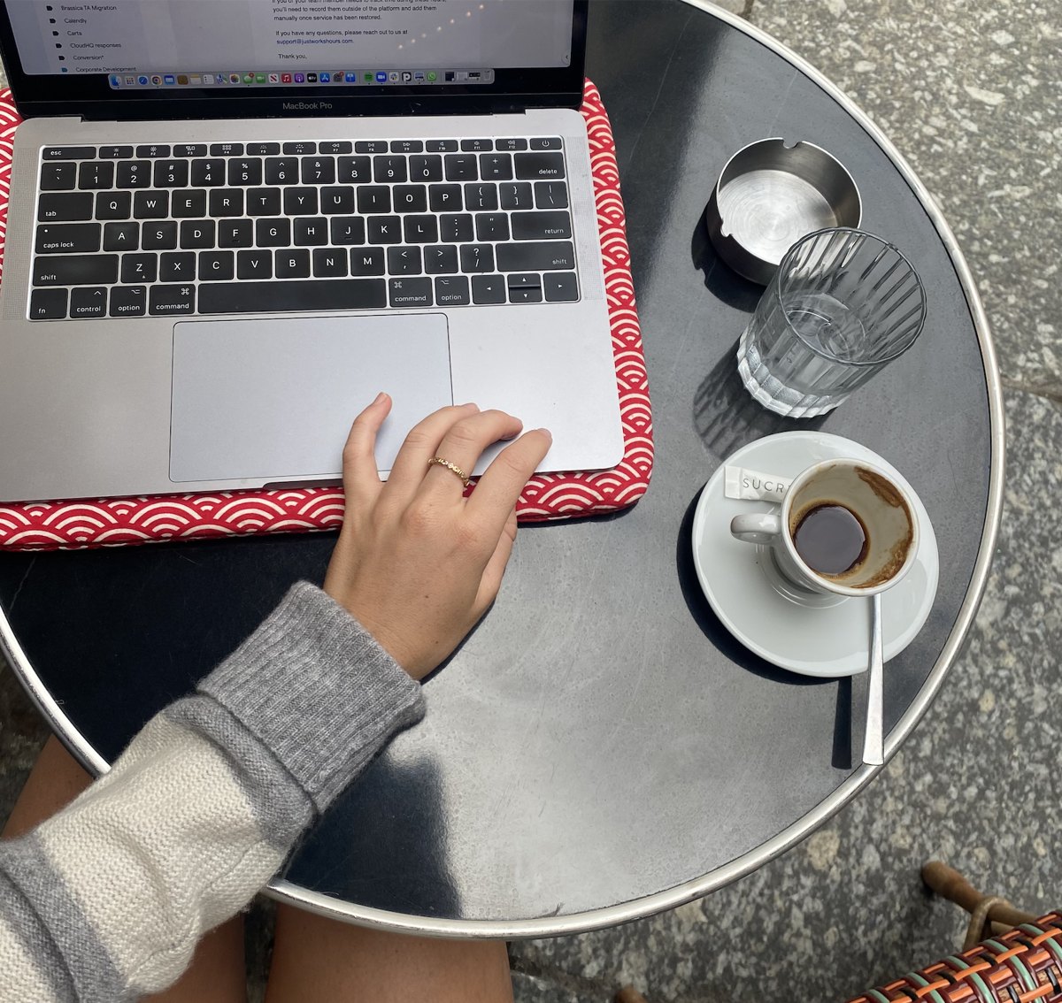 Laptop and espresso on an outdoor café table